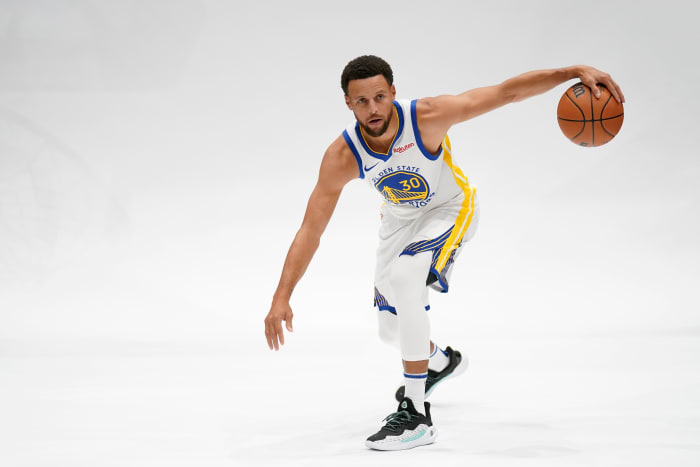Golden State Warriors guard Stephen Curry dribbles the ball during Media Day.
